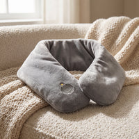 Close-up of the heated neck wrap fabric and heat control button