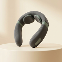 Cordless U-shaped neck massager in charcoal and sage