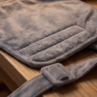 Close-up of the heated back and body wrap's quilted panel and strap