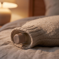 Close-up of the comfort bottle's oat knit cover, neck and screw stopper