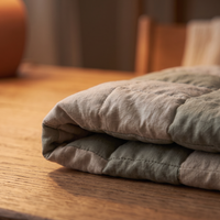 Close-up of the weighted lap pad's quilted channels and stitching