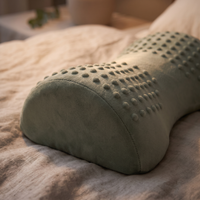 Close-up of the sage acupressure neck pillow's contact points along its curve