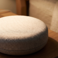Close-up of the sleep sound machine's woven oat fabric top