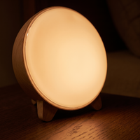 Close-up of the sunrise wake-up light's glowing amber face